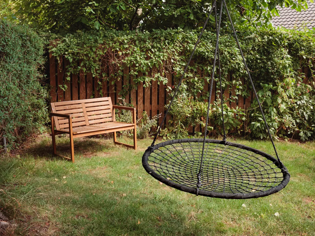 Swing and bench in garden