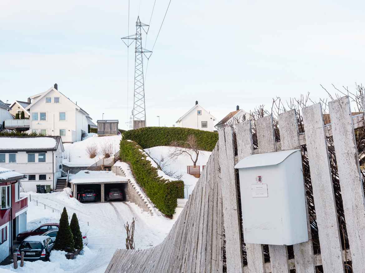Typical Norwegian middle-class naighbourhood with white picket fences and thuja hedges.