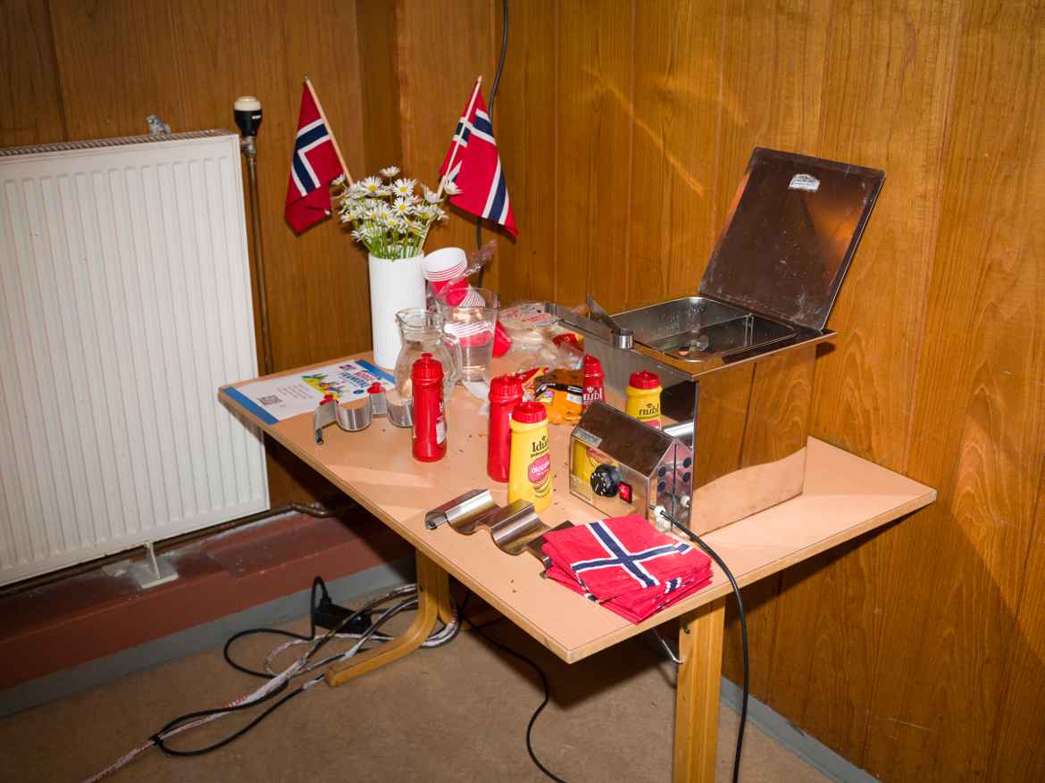 Typical Norwegian community center set-up with steamed hot dogs, ketchup, mustard and Norwegian flags, just like consitution day.