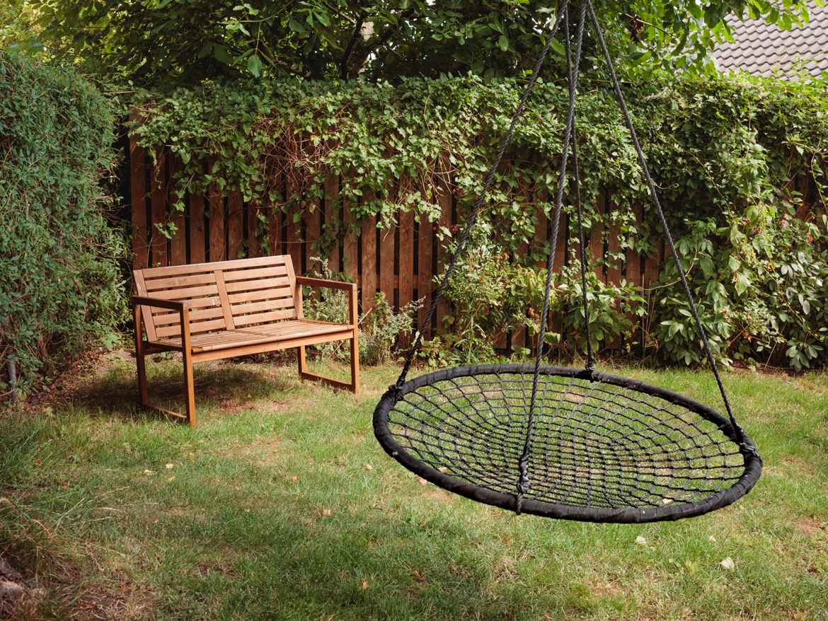 Swing and bench in garden